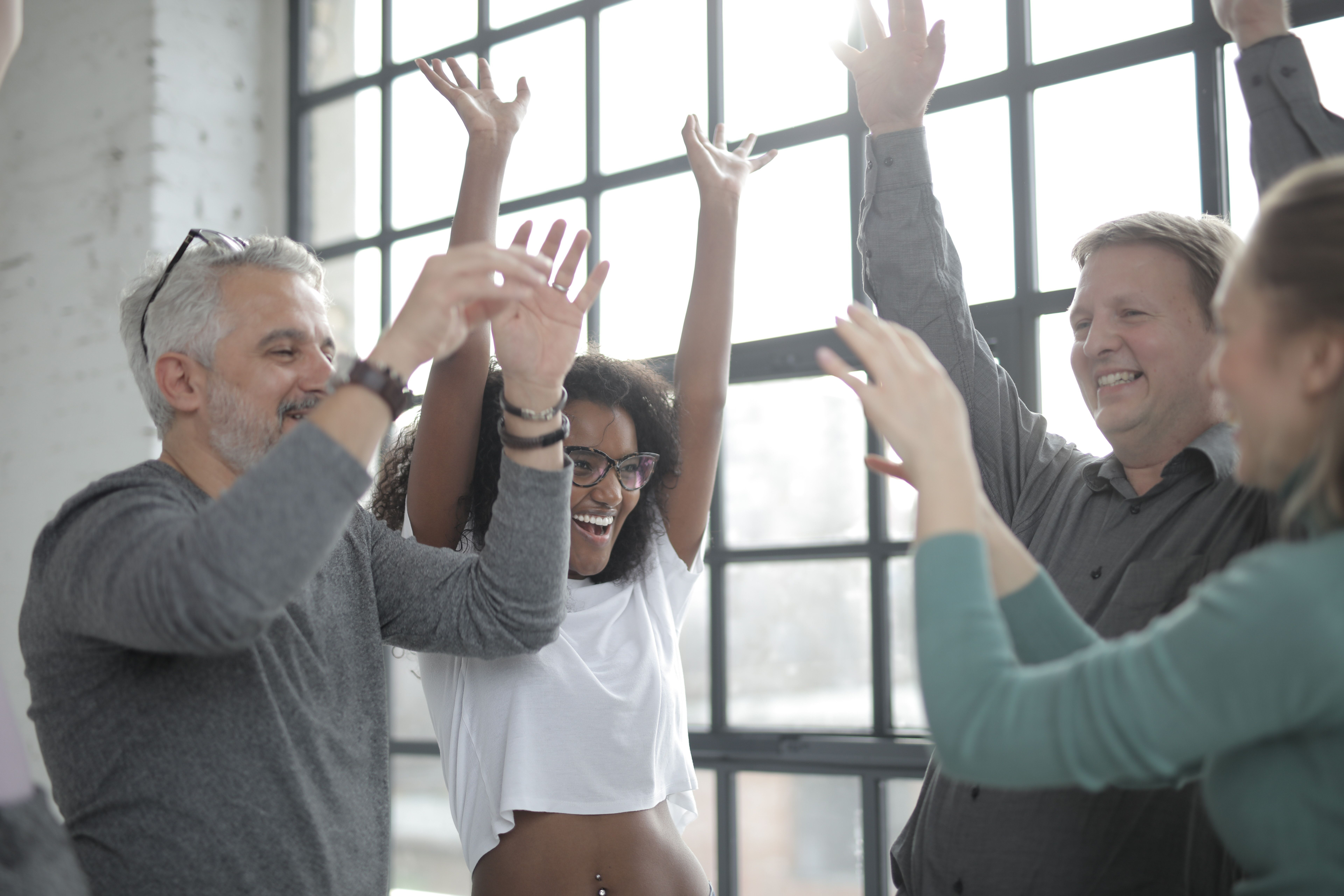 Cencadian participants celebrating during a team activity