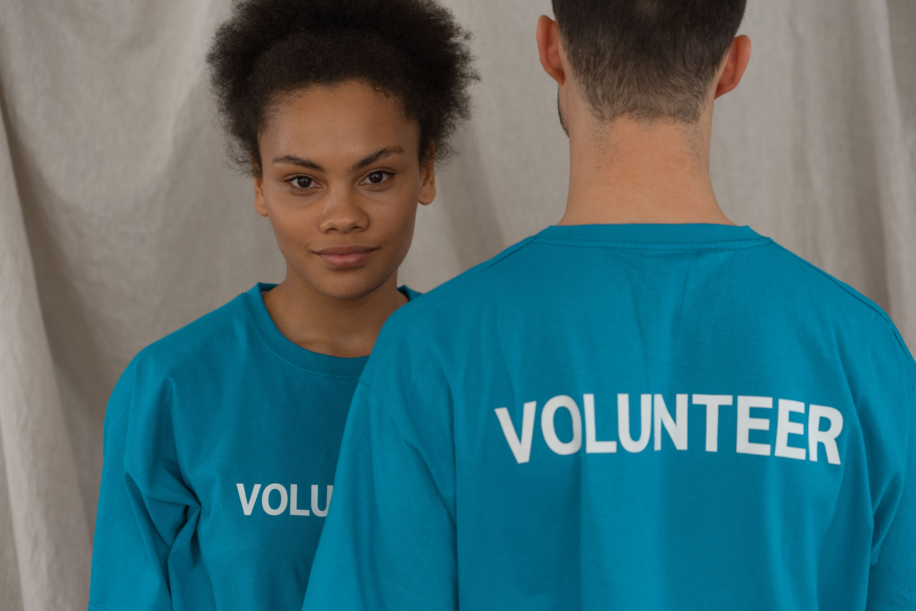 Volunteers wearing matching blue shirts