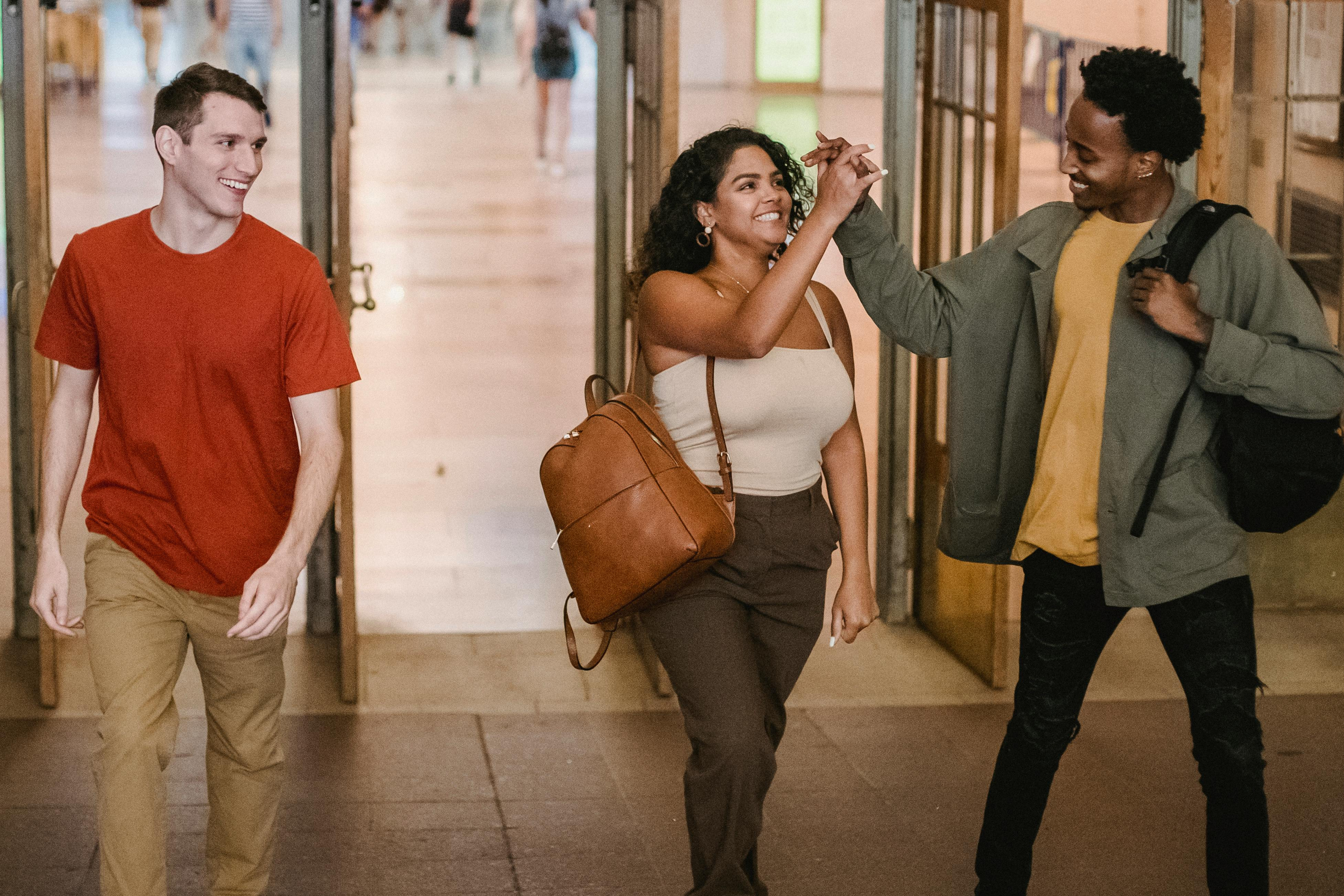 Students celebrating together in a school hallway